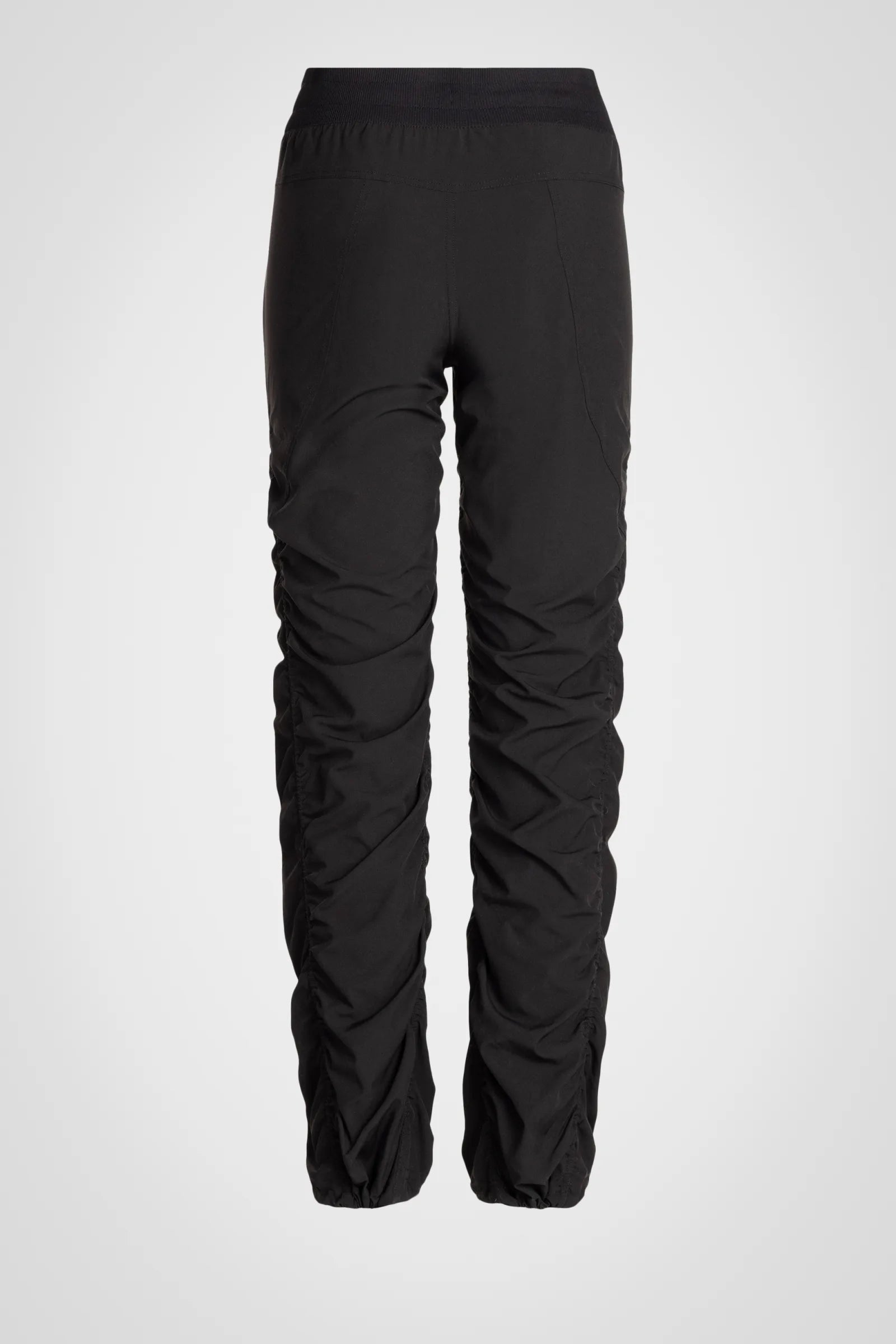 Women’s Black Adventurous Pant, rear product-only view showing the relaxed tapered silhouette and gathered cuffs.