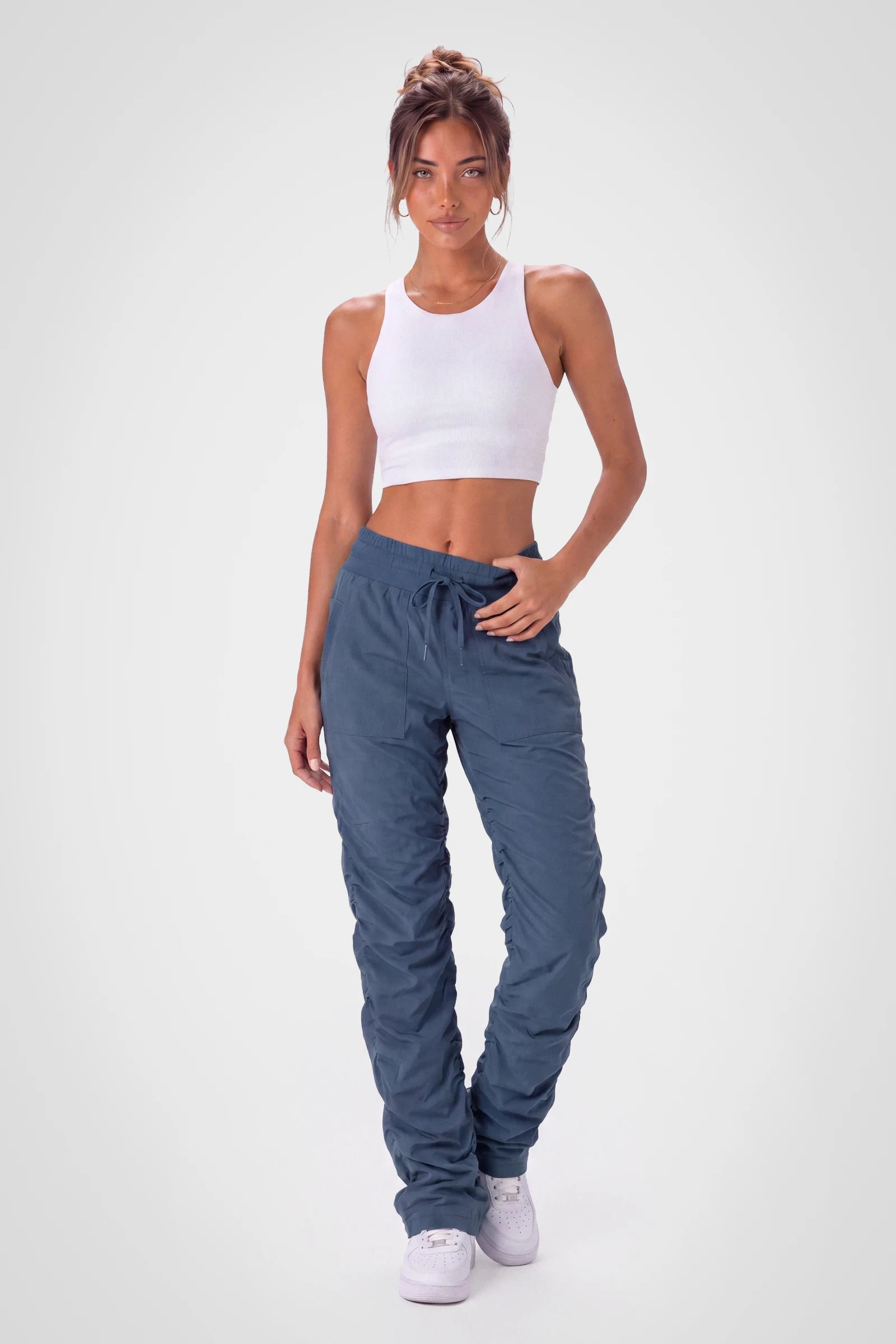 Women’s Key Largo Adventurous Pant, side studio view showing the relaxed tapered leg, patch pocket and gathered cuff.