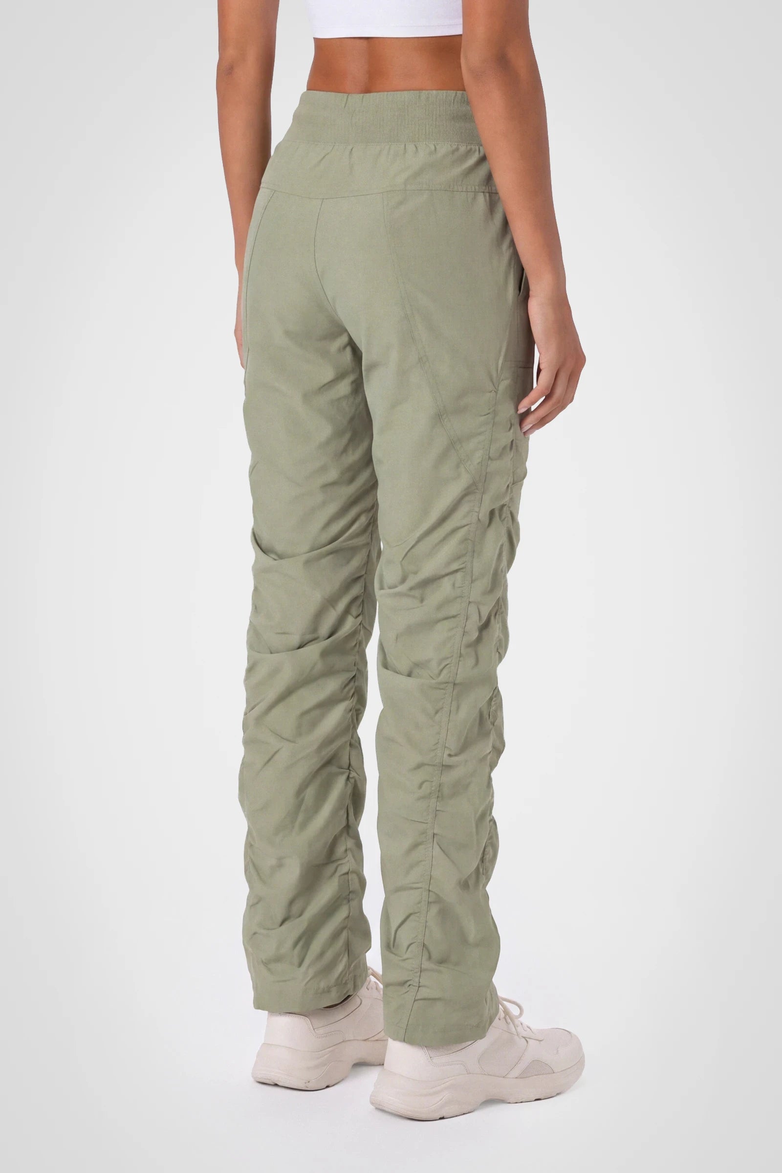 Women’s Silver Sage Adventurous Pant, three-quarter studio view showing the tapered leg and gathered hem.